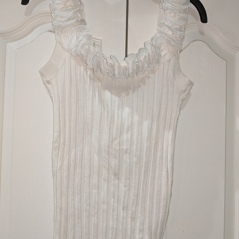 Bellini sleeveless ruffled neckline ribbed top